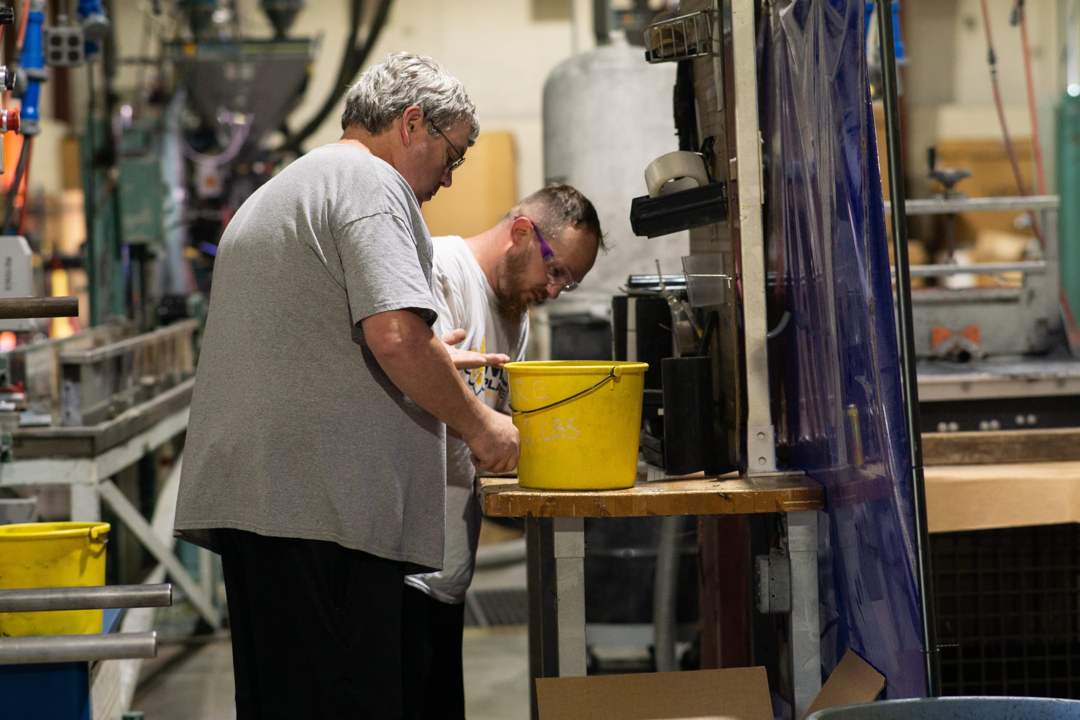 Hamilton facility team members checking production materials